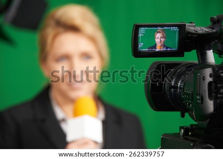 Female Journalist Presenting Report In Television Studio