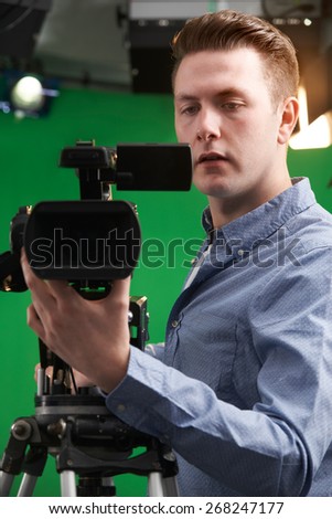 Male Camera Operator In Television Studio