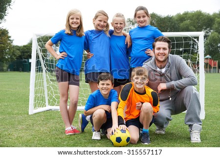 Portrait Of School Soccer Team With Coach