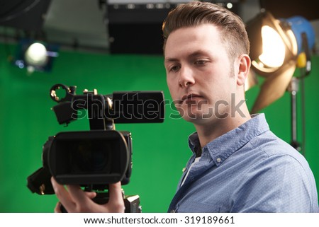 Cameraman Working In Television Studio