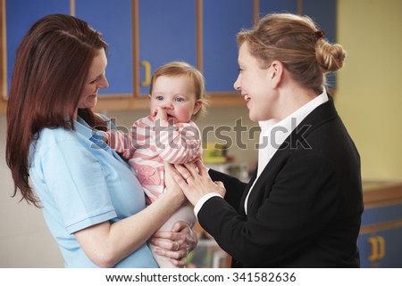 Working Mother Dropping Child At Nursery