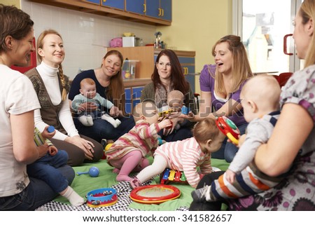 Group Of Mothers With Babies At Playgroup