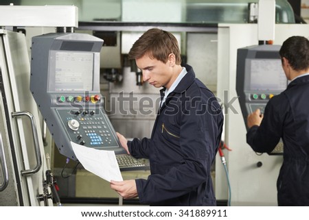 Engineer Operating Computerized Cutting Machine
