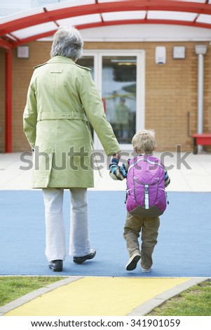 Grandmother Taking Grandson To School