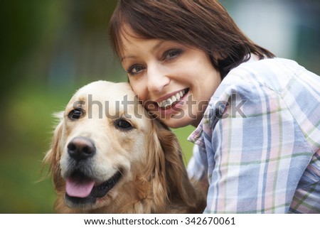 Woman With Pet Golden Retriever