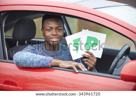 Teenage Boy Recently Passed Driving Test Holding P Plates
