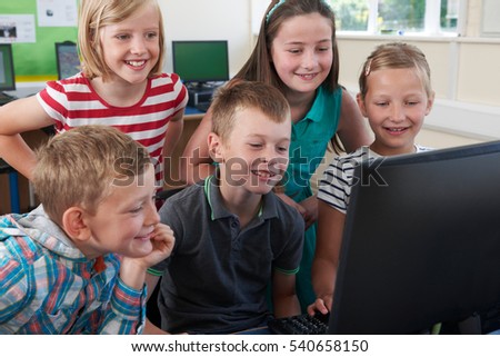 Group Of Elementary Pupils In Computer Class