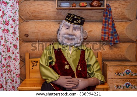 TATARSTAN, RUSSIA - NOVEMBER 11, 2015: Tatar village a museum in the city Kazan, Tatarstan, Russia. Tatar doll grandparents