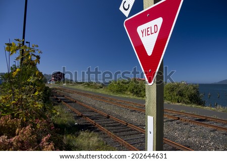 Yield sign at a railroad crossing