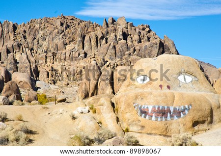 Hand painted monster face on a rock in the Alabama Hills of California.