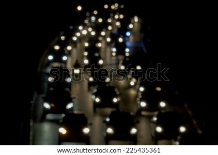 Blurred De-focused Lights of Heavy Traffic on a Wet Rainy City Road at Night - Commuting at Rush Hour Concept