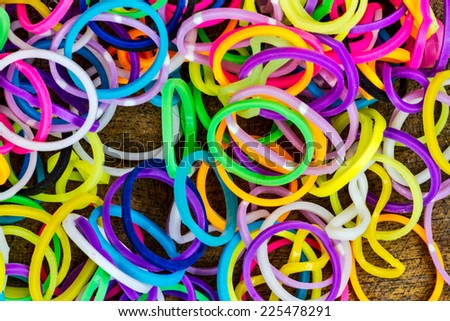 colorful Rainbow loom bracelet rubber bands fashion on old wood