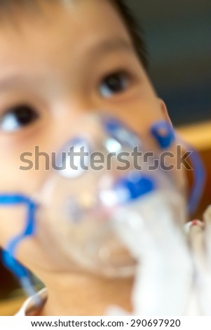 blurry of breathing treatment to a child