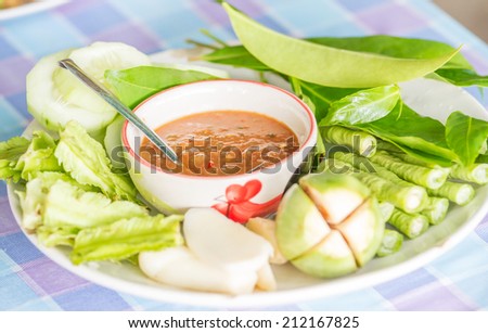 a hot sauce(Little Shrimp,chili paste) made with tomatoes, chilies, and spices. along with vegetables (food Thailand).