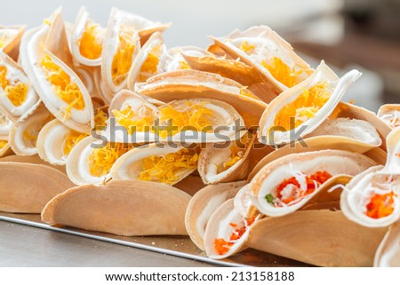 Pancakes (dessert Thailand) Add coconut milk, cream, sugar and eggs on a sheet pan and roll.