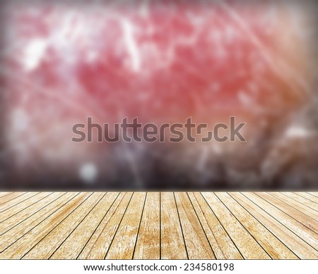 Wood slabs arranged in perspective and abstract marble background (blurred)..