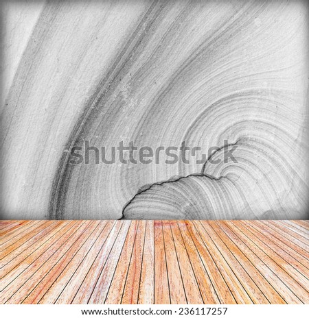 Backdrop sandstone wall and wood slabs arranged in perspective texture background in black and white..