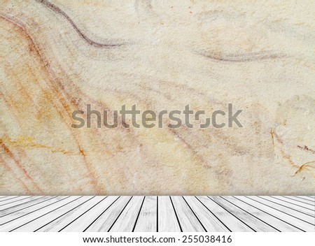 Backdrop sandstone wall and wood slabs arranged in perspective texture background.