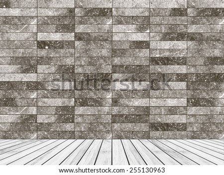 Backdrop gray marble brick wall and white wood slabs arranged in perspective texture background.