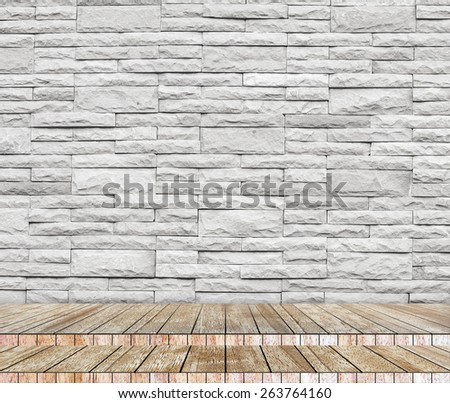 Backdrop sandstone brick wall and wood slabs arranged in perspective texture background.