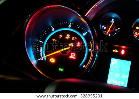 speed gauge with engine light.
