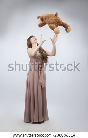 young woman holding toy