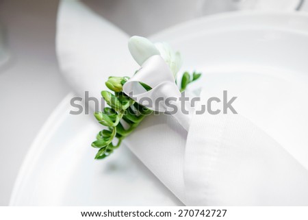 plate in restaurant. white napkin on the table