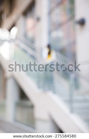 blur the background. blurred girl gets up the stairs