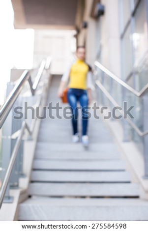 blur the background. blurred girl down the stairs