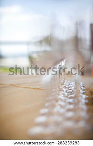 Beautiful champagne glasses defocused on buffet table in restaurant and blurred background