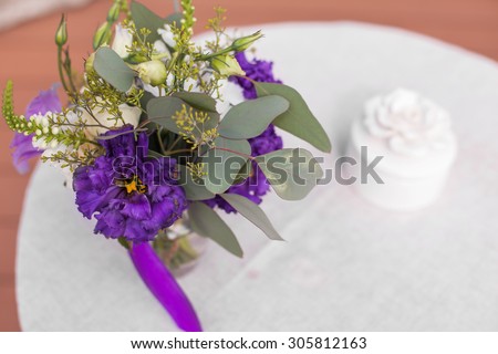 bright purple wedding bouquet of roses and eucalyptus