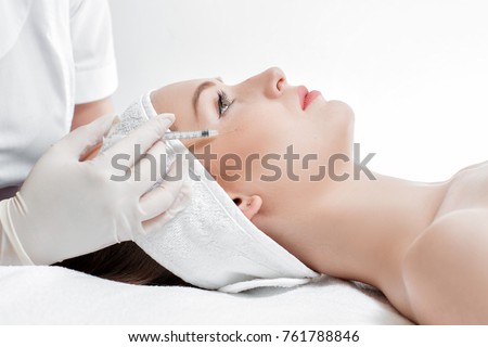 woman getting injection. beauty injections and cosmetology
