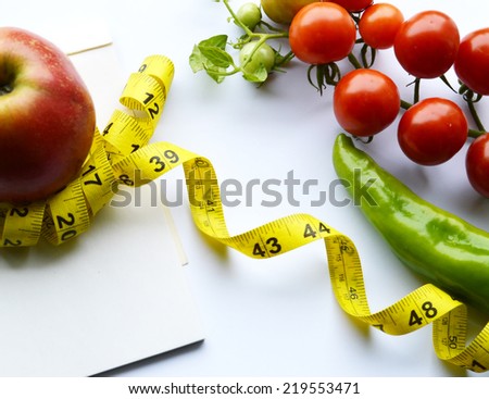 vegetables and fruits for weight loss, a measuring tape, diet, weight loss,cherry tomatoes, green peppers
