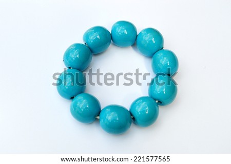 blue wooden bracelet isolated on white background