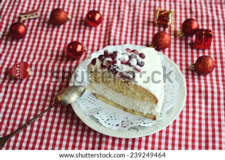 biscuit cake with curd cream decorated with cranberries, Christmas sweets.orange, Christmas mood