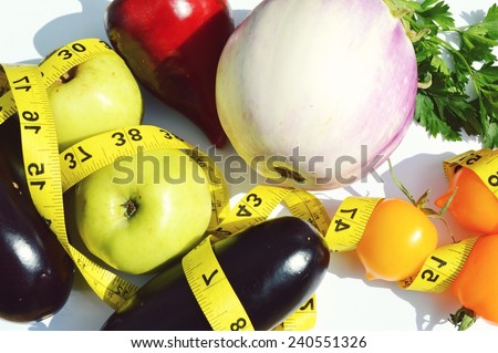 vegetables and fruits for weight loss, a measuring tape, diet, weight loss, measuring tape, healthy eating, healthy lifestyle concept.Notepad,diary,eggplant,Apple,pear