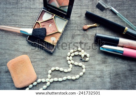 Makeup Eyeliner brush with bottle ,set of cosmetics,Make-up and brushes,powder, puff, mascara, eyeliner  on  wood table