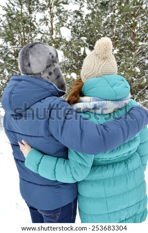 loving young couple,hugging, turned back,looking at the forest