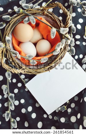 Easter eggs in basket.Easter greeting card with words\