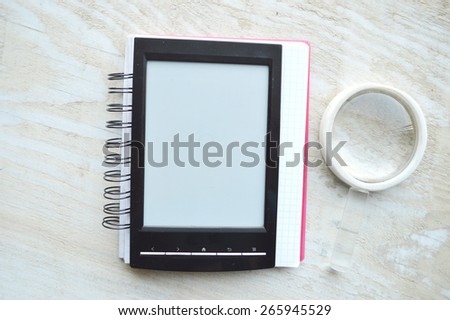 black e-book  for reading,reading glasses.red notebook for records