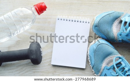 a bottle of water .running, healthy eating, healthy lifestyle concep.dumbbells, exercise