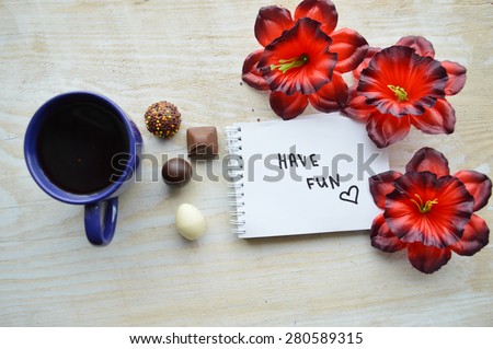 cup of hot coffee, notepad, wish good morning, flowers