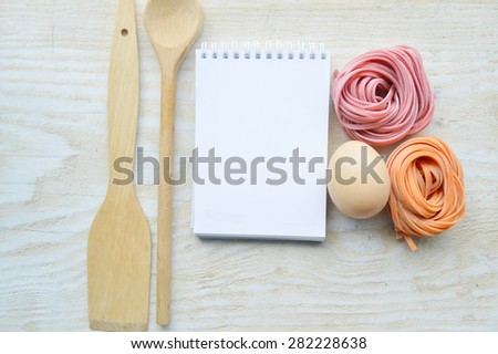 recipe book,vegetables(carrots, spinach, tomato) raw colored paste