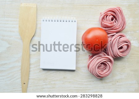 recipe book,vegetables(carrots, spinach, tomato) raw colored paste