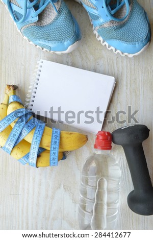 sneakers, centimeter.weight loss, running, healthy eating, healthy lifestyle concep.banana, water