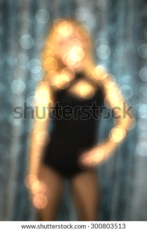 blurred background  of sexy girl dancing on the pylon