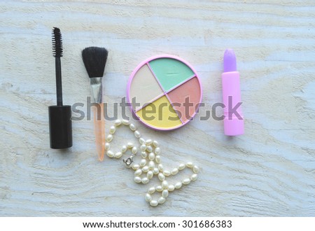 Makeup Eyeliner brush with bottle ,set of cosmetics,Make-up and brushes,powder, puff, mascara, eyeliner on wood table,false eyelashes,brush