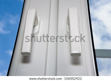 PVC handles on plastic window