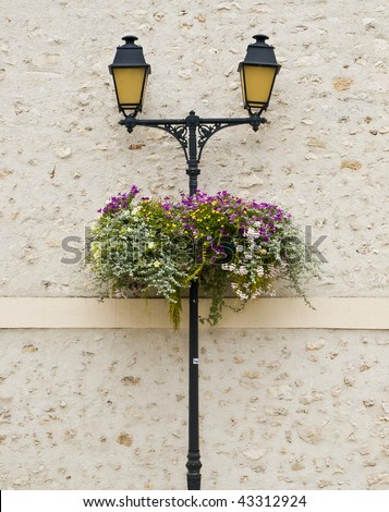 Yellow street lamps in small countryside city. France.