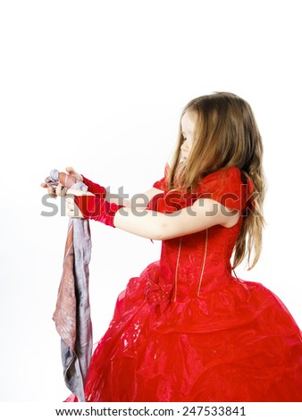 Young cinderella dressed in red preparing to mop the floor by dirty cloth. Contrast things concept.